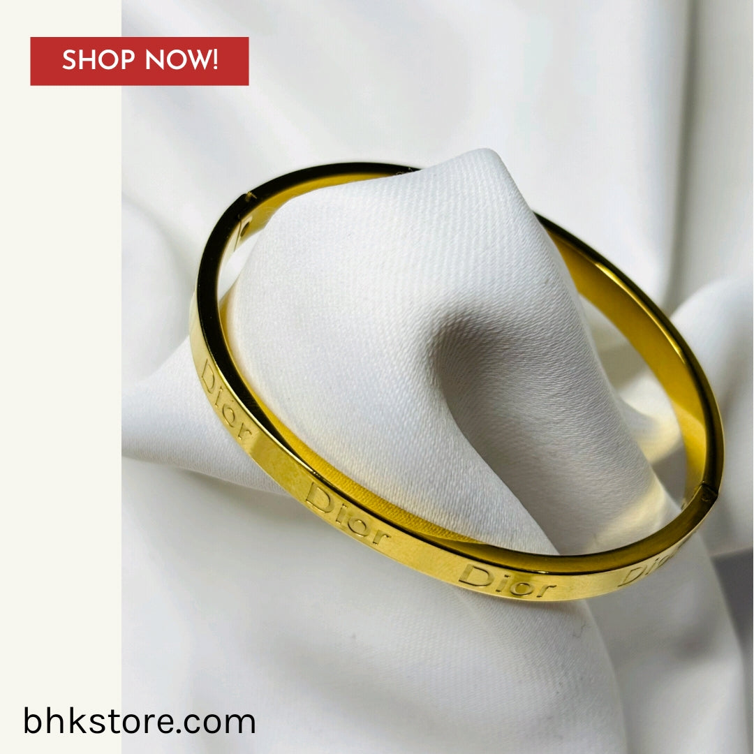 Dior Signature bangle in gold-finish metal